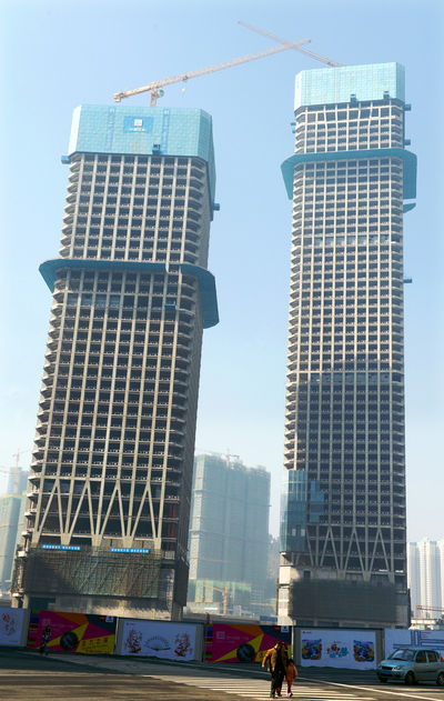 A pair of skyscrapers still under construction at the mega real estate project Huaguoyuan, or Flower and Fruit Garden, in Guiyang.