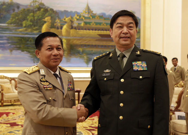 Chinese State Councilor and Defence Minister Chang Wanquan (R) shakes hands with Commander-in-Chief of Myanmar's Defence Services Senior-General Min Aung Hlaing in Nay Pyi Taw, Myanmar, May 19, 2014 Xinhua