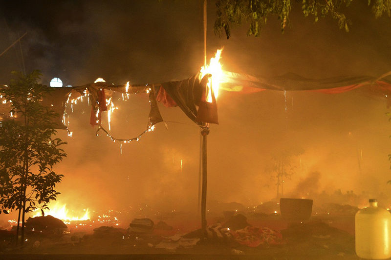 A protesters' encampment burns at the copper mine ELEVEN MEDIA AP Nov 29 2012