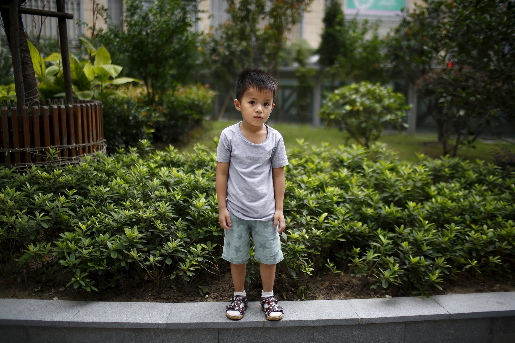 Qin Wuyue, who was born in 2010, poses for a photograph in Shanghai August 22, 2014. When asked if he would like to have siblings, Wuyue said: 'No they're noisy.'