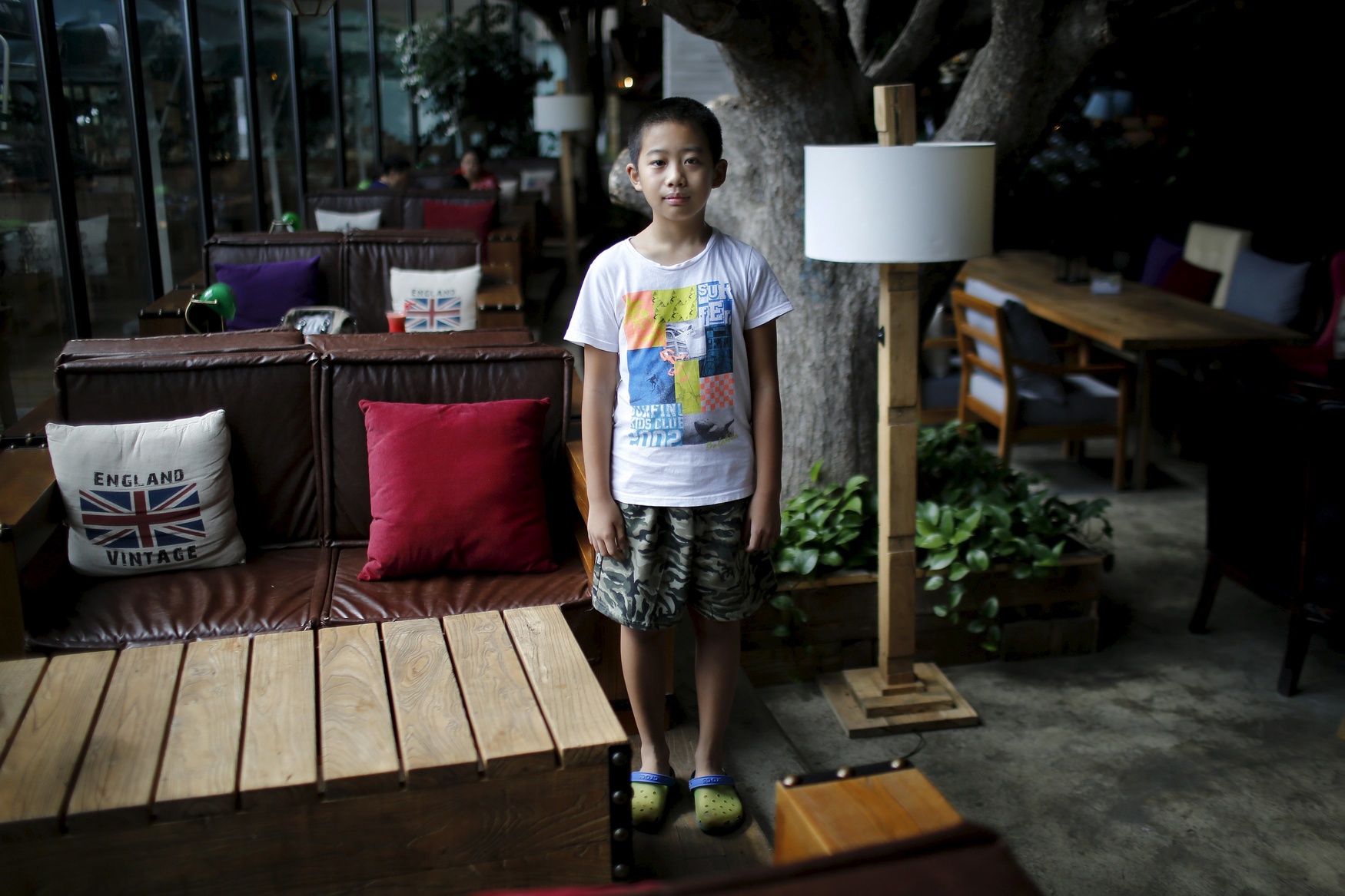Only child Qian Dingheng, who was born in 2005, poses for a photograph in Shanghai August 30, 2014. 'I don't want [a sibling], because he would interrupt my homework,' Dingheng said.