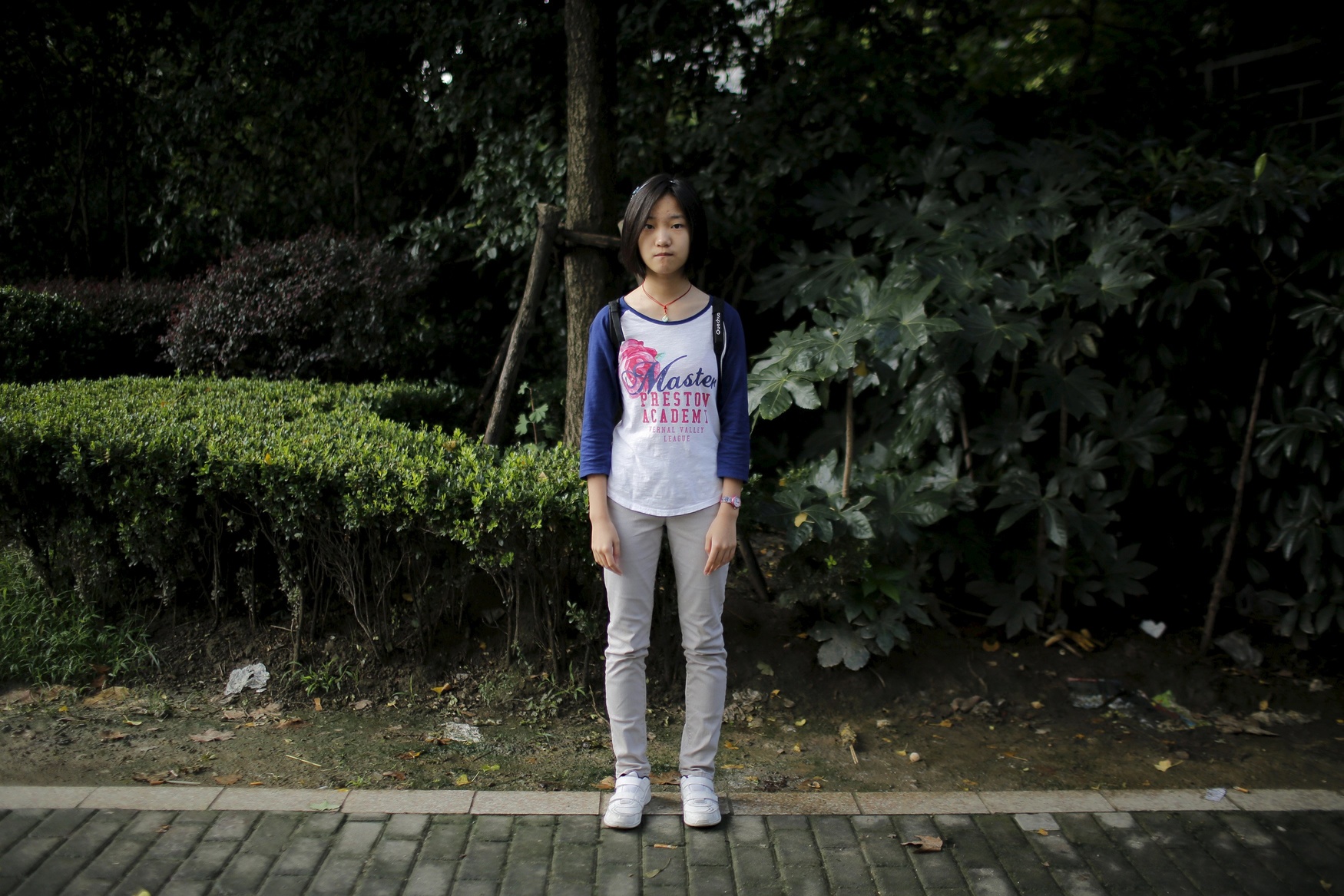 Dai Jingting, who was born in 2001, poses for a photograph in Shanghai September 20, 2014. Jingting said she would like siblings 'because it would be boring for me to stay at home alone.'