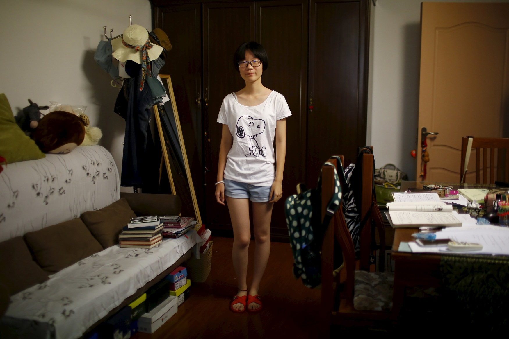 Zhang Xiaoying, who was born in 1998, poses for a photograph in Shanghai August 24, 2014. Xiaoying said, 'If I had a brother older than me, he could help me do many things, play with me.'