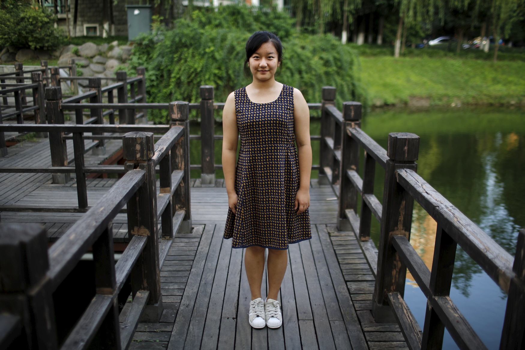 Zhao Mengge, who was born in 1997, poses for a photograph in Shanghai September 6, 2014. 'I'd like to have sisters. Little sisters are not naughty and they are easier to look after,' said Mengge.