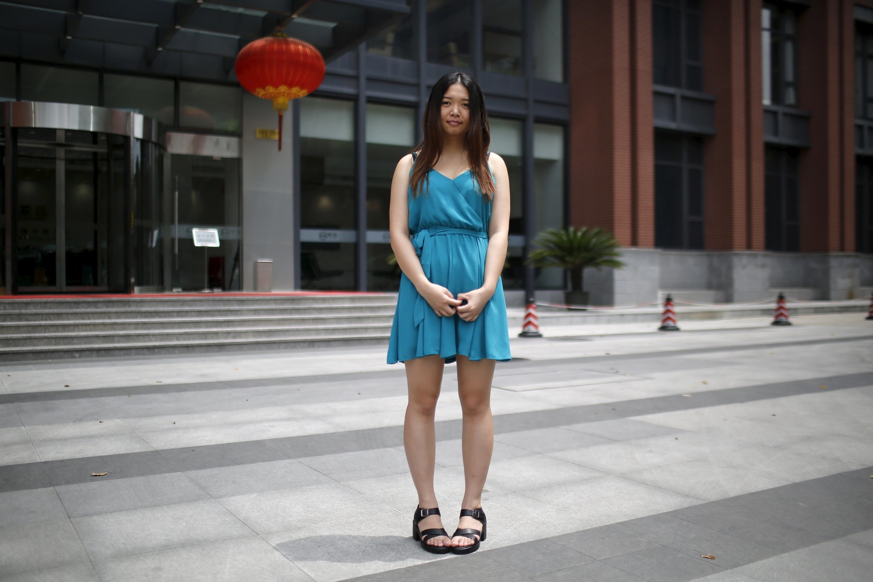 Wang Yanrong, who was born in 1994, poses for a photograph in Shanghai August 16, 2014. Yanrong said: 'I would like to have a brother or a sister because that would be much more fun. There are times when you don't know who to talk to and then it would be better if I had a sibling. I know a cousin who has a sibling and they have a very good relationship.'