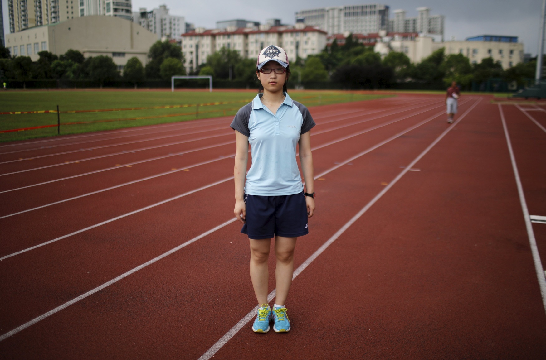Jiang Chencheng, who was born in 1993, poses for a photograph in Shanghai July 23, 2014. Chencheng said: 'I wouldn't like to have a brother or a sister because I would have to share the [family's] financial [resources] with them and it would be very difficult for our parents to send them to good universities.'