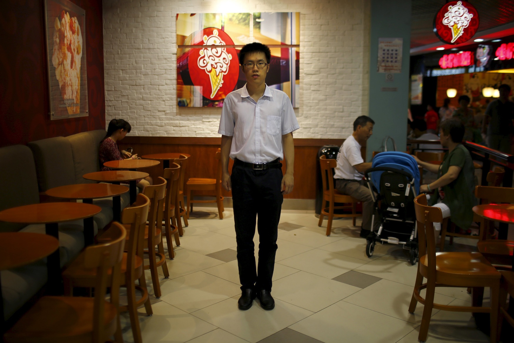 Zhang Haoran, who was born in 1990, poses for a photograph in Shanghai August 22, 2014. Haoran said: 'It would be a good thing to have brothers or sisters who are of similar age. Then some problems that arise in our adulthood might be solved [more easily]. For example, communication with peers, and also learning sharing, individualism.'
