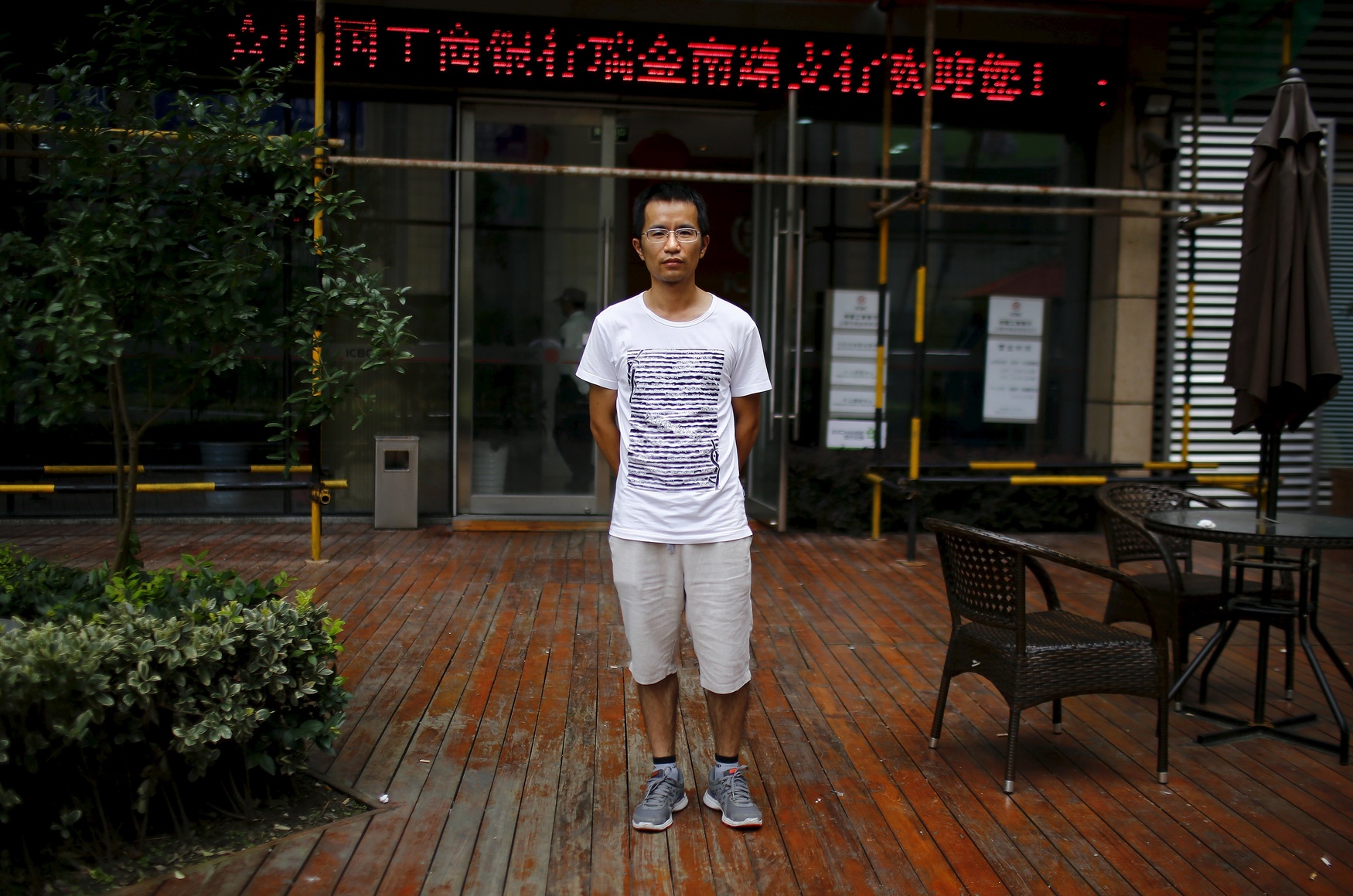 Qin Wen, who was born in 1983, poses for a photograph in Shanghai August 22, 2014. Wen said: 'I think it's good to have a brother or a sister.'