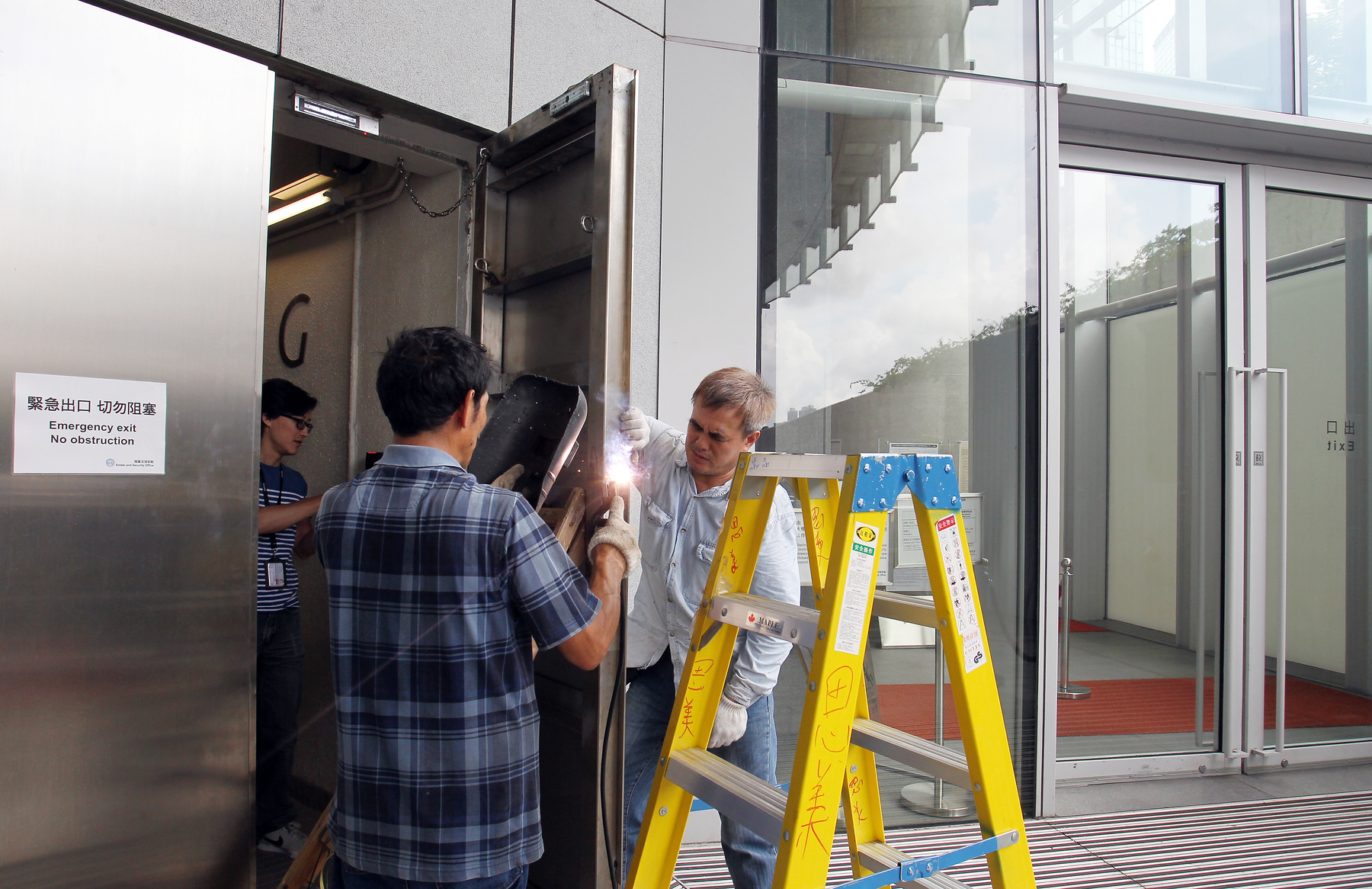 Metal doors at the Hong Kong government headquarters in Admiralty are reinforced on June 12, 2015 as part of measures to bolster security ahead of the reform vote.