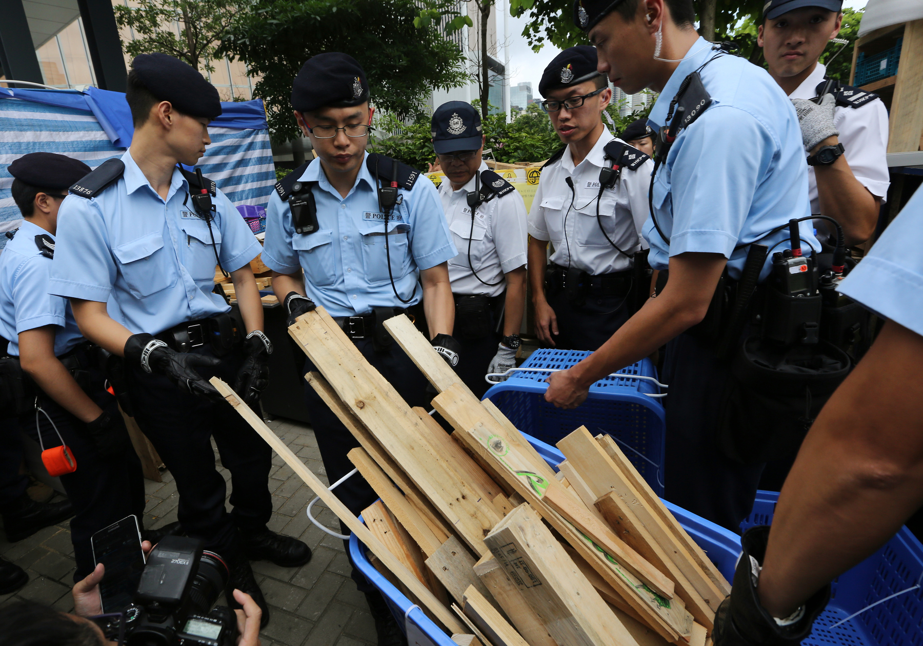 Police remove wooden planks, among other objects deemed a ‘risk’ to public safety, from the remaining Occupy Central tents camped outside Legco on June 13, 2015.