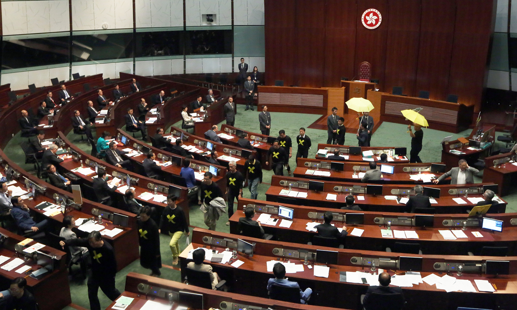 Pan-democrats walk out of Legco before Chief Secretary Carrie Lam was scheduled to give a speech about the government’s political reform proposal.