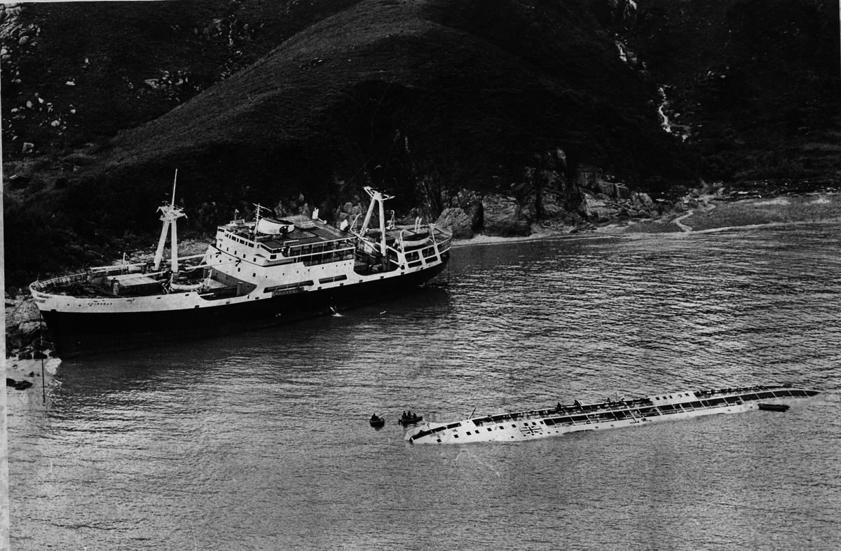 The Fatshan lies almost submerged off the coast of Lantau after being sunk during Typhoon Rose, killing 88 people onboard