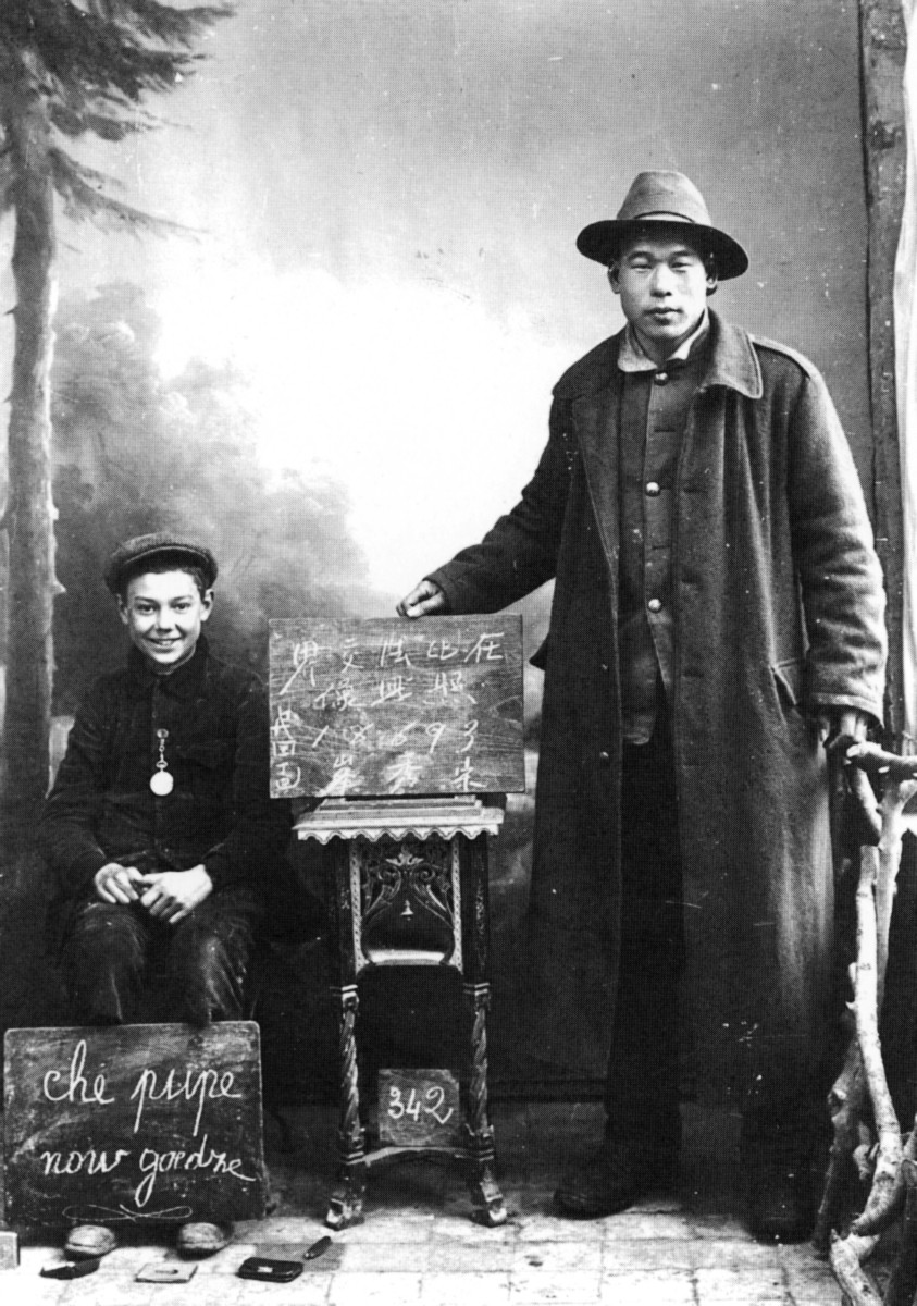 Chinese labourer Song Xiufeng with Maurice, son of photographer René Matton, in Proven, Belgium, 1917. Photo: In Flanders Fields Museum, Ypres