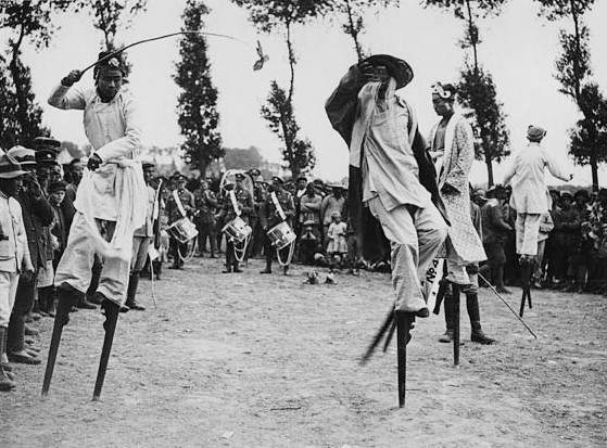 A dragon day celebrated by the Chinese workers in France. A display on stilts. Photo: National Library of Scotland